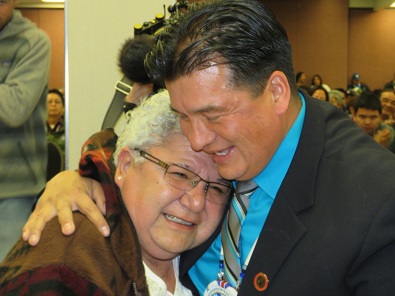 Newly elected FSIN Chief Bobby Cameron is embraced by his nominator OKanese First Nation Chief Mary Anne Day Walker-Pelletier. Photo by Mervin Brass