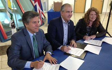 Mark Dockstater (far left), Riel Bellegarde (centre) were among those to sign the agreement at FNU on Monday. Photo by Manfred Joehnck