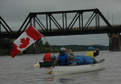 River Runners putting away canoes and kayaks after successful youth trips