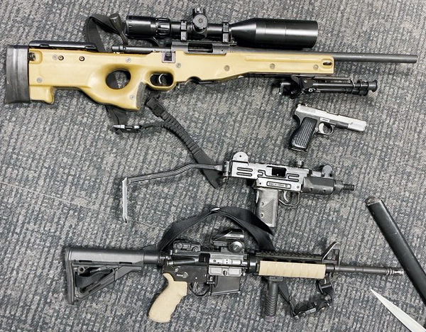 Replica machine gun and prohibited pistol seized by authorites